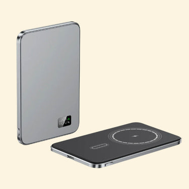 Two Grey slim wireless charging devices displayed on a beige background, showcasing front and top views with digital battery indicator and magnetic charging ring